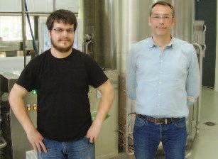 Marc Neyret (left) and Romain Flesch (right).  In the background, the lauter tun and whirlpool.