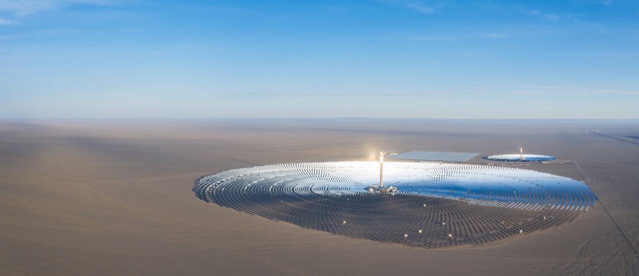 Aerial view of solar thermal power station, with molten salt tower, Dunhuang City, Gansu province, China. Photo Dreamstime. Aerial view of solar thermal power station, with molten salt tower, Dunhuang City, Gansu province, China. Photo Dreamstime.